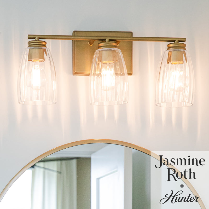 Hunter Rossmoor Luxe Gold with Clear Glass 3 Light Bathroom Vanity Wall Light Fixture - Jasmine Roth Collection